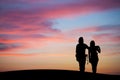 Silhouetted couple watching sunset sky Royalty Free Stock Photo