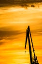 Silhouetted cranes at shipyard, Royalty Free Stock Photo