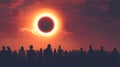 Silhouetted crowd watching solar eclipse at sunset Royalty Free Stock Photo