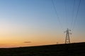 Silhouetted Electricity Pylons at Sunset Royalty Free Stock Photo