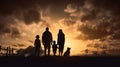 Silhouetted family with children and pet take in the beauty of the sky