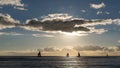 Silhouetted floating sailing boats at the sunset at Waikiki beach, Honolulu, Oahu island, Hawaii, USA Royalty Free Stock Photo