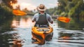 Silhouetted kayaker paddling at sunset on the sea, enjoying water sports adventure Royalty Free Stock Photo