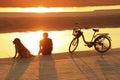 Silhouetted man watching sunset at Mekong river