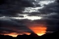 Silhouetted mountains and fiery sunset Royalty Free Stock Photo