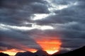 Silhouetted mountains and a fiery sunset Royalty Free Stock Photo