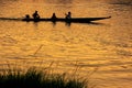 Silhouetted people in a boat at sunset on Nam Song River in Van Royalty Free Stock Photo