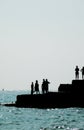 Silhouetted People On Brighton Coast