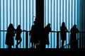 Silhouetted people in building Royalty Free Stock Photo