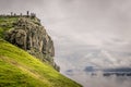 Silhouetted people on a mountain top enjoying the view