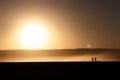 Silhouetted people at the sunset Royalty Free Stock Photo