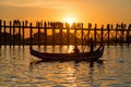 Silhouetted people on U Bein Bridge at sunset, Amarapura, Mandalay region, Myanmar