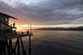 Silhouetted people on Venice Pier at sunset, California Royalty Free Stock Photo