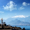 Silhouetted people walking in Antalya harbor