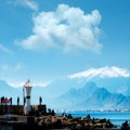 Silhouetted people walking in Antalya harbor