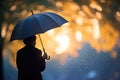 silhouetted person under an umbrella in the rain