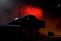 Silhouetted Piano Shape on Stage
