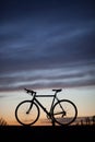 Silhouetted race bike in sunset