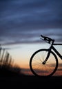 Silhouetted race bike in sunset