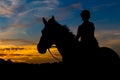 Silhouetted Rider At Sunset