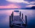 Silhouetted rowing boat on Lake Garda, Italy