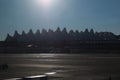 Silhouetted skyline of Denver International Airport Jeppesen Terminal against blue morning sky