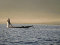 Silhouetted traditional fisherman on Inle Lake Myanmar