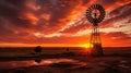 Silhouetted windmill at sunset Royalty Free Stock Photo