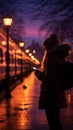 Silhouetted woman waits on platform, phone lit by passing train s glow