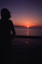 Silhouette Woman watching sunset from ship Royalty Free Stock Photo