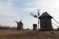 Silhouettes ancient windmils rural landscape. National Open Air Museum of Folk Architecture Pirogovo