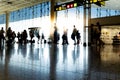 Silhouettes of anonymous travelers at Barcelona airport.