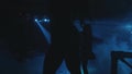 Silhouettes of people dancing in the dark