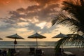 Silhouettes of beach umbrellas sunset and sky Royalty Free Stock Photo