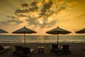 Silhouettes of beach umbrellas sunset and sky Royalty Free Stock Photo