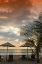 Silhouettes of beach umbrellas sunset and sky Royalty Free Stock Photo