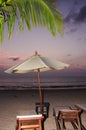 Silhouettes of beach umbrellas sunset and sky Royalty Free Stock Photo