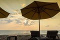 Silhouettes of beach umbrellas sunset and sky Royalty Free Stock Photo