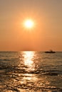 Silhouettes of the boat in the sunset sky Royalty Free Stock Photo