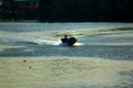 Silhouettes of boats fishing in running water. Royalty Free Stock Photo