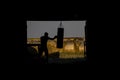 Silhouettes of a boxer on the background of the field Royalty Free Stock Photo