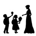 Silhouettes boy and girl give flowers to the teacher. Back to school. Royalty Free Stock Photo