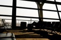 Silhouettes of business man at airport; waiting at the plane boarding gates. Royalty Free Stock Photo