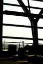 Silhouettes of business man at airport; waiting at the plane boarding gates. Royalty Free Stock Photo