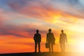 Silhouettes of business man people group with sunset background, Power of success teamwork concept Royalty Free Stock Photo