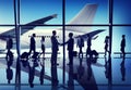 Silhouettes of Business People on an Airport Royalty Free Stock Photo