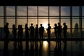 Silhouettes of business people in blurred meeting room. Business teamwork concept. Group of Business People Working in Royalty Free Stock Photo