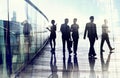 Silhouettes of Business People in Blurred Motion Walking Royalty Free Stock Photo