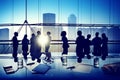 Silhouettes of Business People Gathered Inside the Office Royalty Free Stock Photo