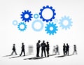 Silhouettes of Business People and Gears Above Royalty Free Stock Photo